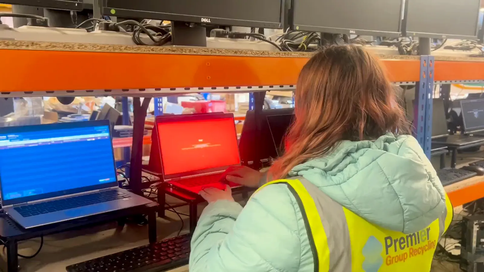 Premier IT Disposal team member securely wiping laptops in the Premier workshop