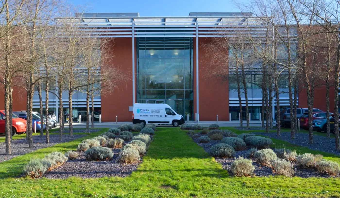 Premier IT Disposal van parked outside of client building
